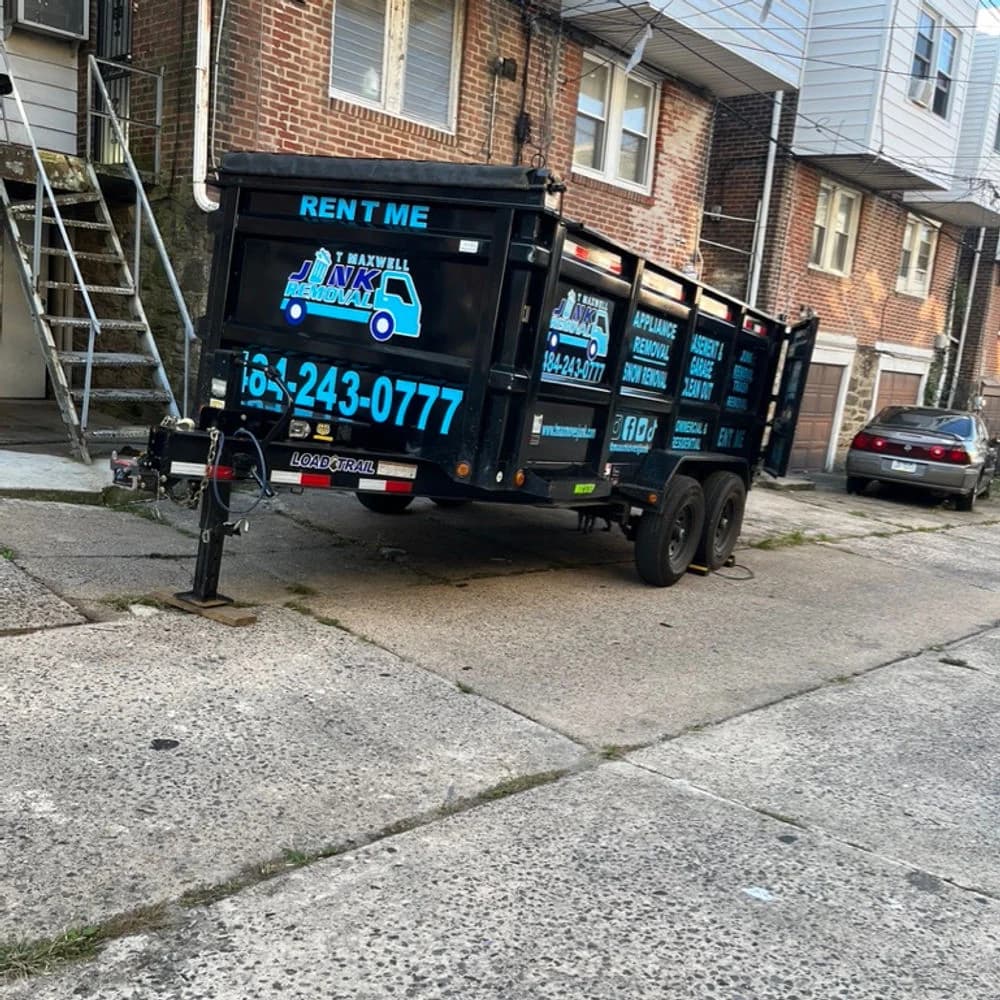 T Maxwell dumpster parked at a Delaware County property
